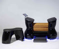 Load image into Gallery viewer, Modern black and gold chair with LED lighting on a white background
