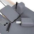 Load image into Gallery viewer, Elina Pilates Vertical Reformer For Home Gray Folded Parts View
