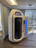 Load image into Gallery viewer, White medical device with digital display in a room with large windows
